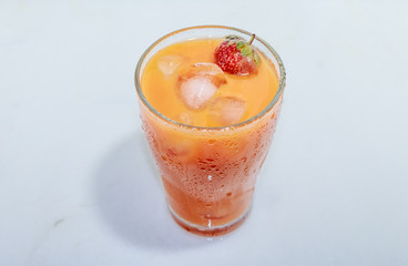 Сarrot juice with strawberries and ice