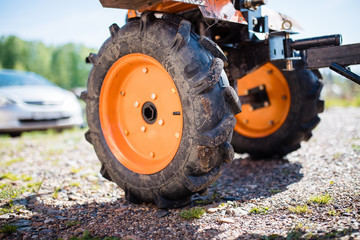 Large dump truck wheels on the ground. tractor wheel close-up.