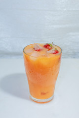 Сarrot juice with strawberries and ice