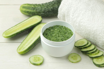 Face mask with cucumber. Cosmetics with cucumber extract on a white wooden table. spa. beauty.