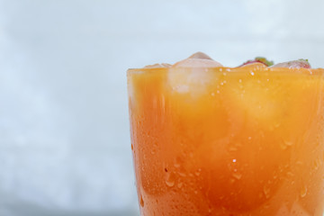 Сarrot juice with strawberries and ice