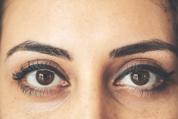 Beautiful female eyes with long eyelashes, closeup
