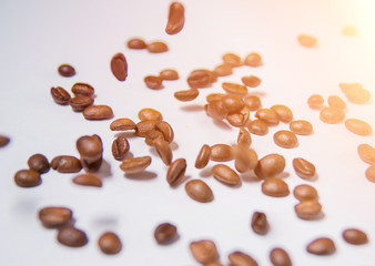 coffee beans isolated on white background.a lot of flying coffee beans on a white background