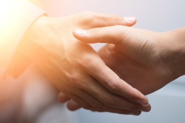 Fototapeta premium Collaboration in a business team. the handshake of a business partnership. two businessman handshake processes. A successful deal after a great meeting. Horizontal, blinking effect, blurred background