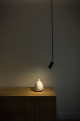 white vase on wooden shelf