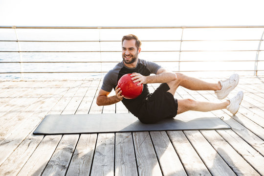 Concentrated young sportsman working out - Powered by Adobe