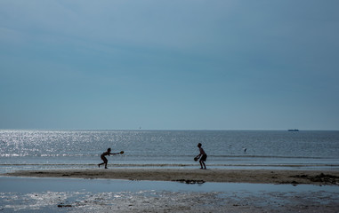 Fototapeta na wymiar Playing ballgame. Beach and dunes North Sea coast. Julianadorp