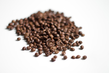 coffee beans brown on white isolated background with close-up location with blurred background