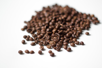 Fototapeta na wymiar coffee beans brown on white isolated background with close-up location with blurred background