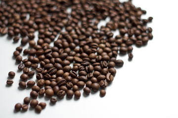 coffee beans brown on white isolated background with close-up location with blurred background