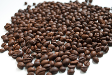 coffee beans brown on white isolated background with close-up location with blurred background