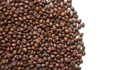 brown coffee grains on a white isolated background with space top view