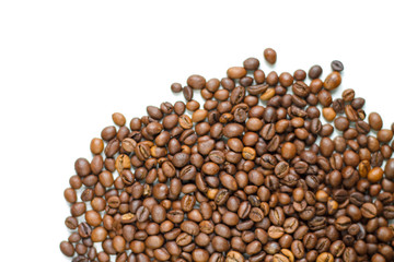 brown coffee grains on a white isolated background with space top view