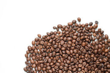 brown coffee grains on a white isolated background with space top view