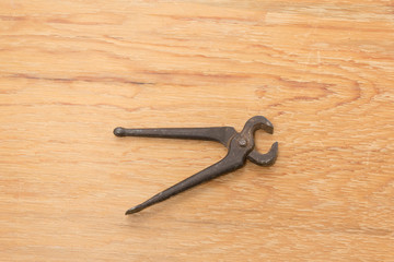 Old tools. Pincers. A tool  used for gripping and pulling things.