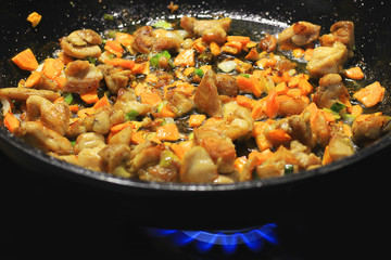 Cooking in a pan. Roasted meat and vegetables