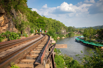 Tourists walking on the Death railway on vacation