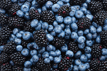 Blackberry and  blueberry background. Top view.