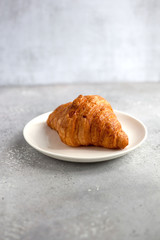  Сroissant on white plate