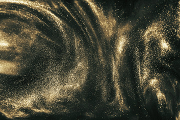 Abstract black and gold festive glitter shimmering magic luxury background. de-focused