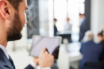 Business man using tablet computer