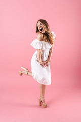 Beautiful young blonde girl wearing summer dress
