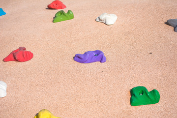 Stones-hooks for children's climbing wall. Children's park in the fresh air. Closeup