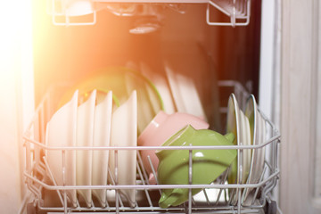 Open dishwasher with clean glass and dishes, selective focus, Clean after washing in the...