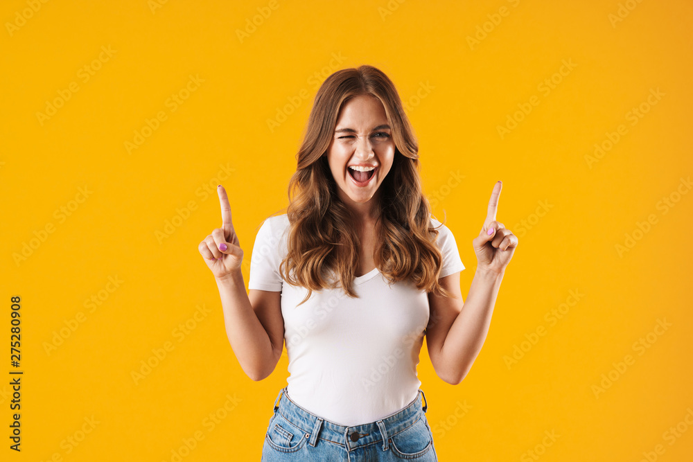 Poster Excited young girl wearing casual clothes standing