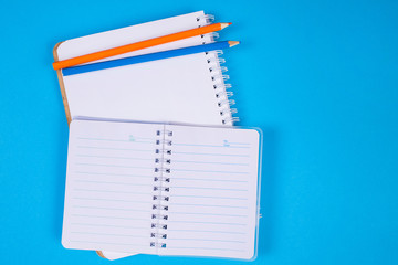 notebooks with pencils