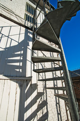 Naklejka premium Metal spiral external stairs