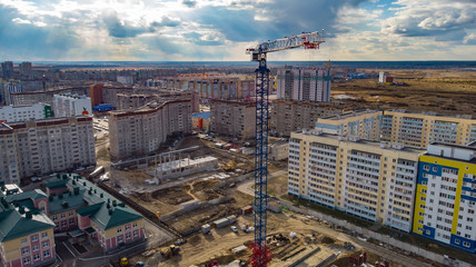 the crane installation above the city, photographed by a drone from close range