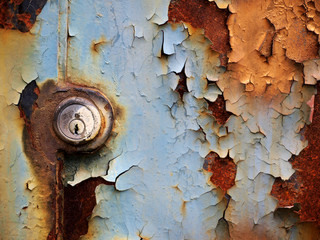 Old, rusty lock. Oxidized metal door hiding a mysterious secret.