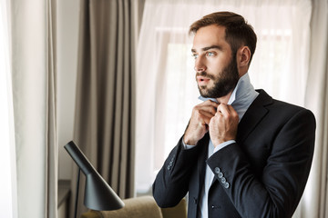 Attractive young businessman wearing suit
