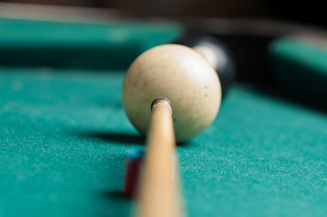 Old billiard ball 8 on a green table. billiard balls isolated on a green background
