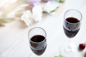 glasses of red wine flowers