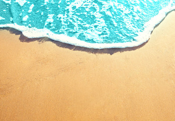 Fototapeta na wymiar Golden sandy beach with sea surf. Best ocean beaches background
