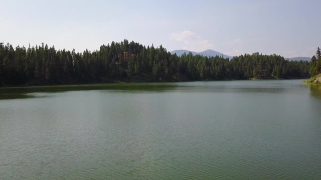 passing over the lake. going forward and sidle, slow and low. aerial(drone) footage. v10