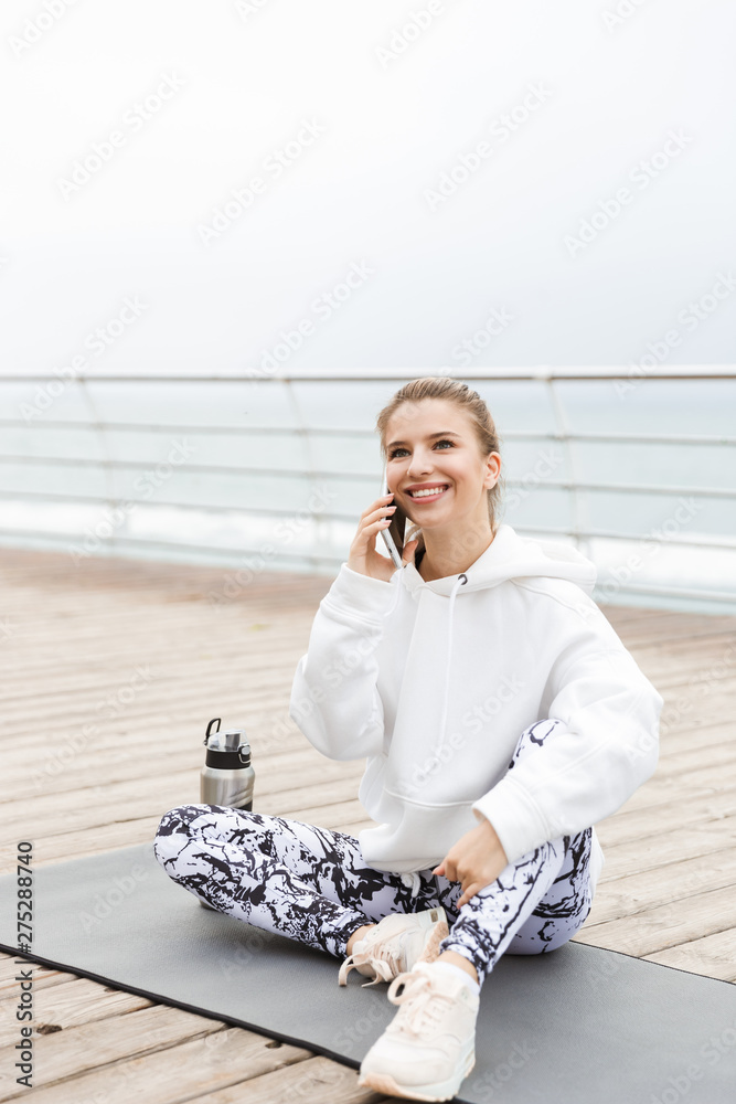 Canvas Prints Attractive young sportswoman wearing hoodie