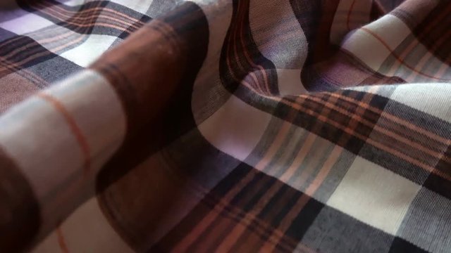 Checkered texture. Plaid material. Close-up. Can be used as a background.