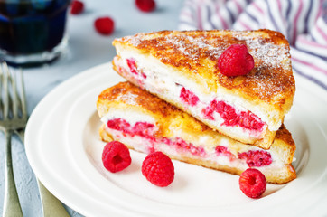 Ricotta raspberry stuffed French Toasts with fresh raspberries