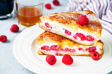 Ricotta raspberry stuffed French Toasts with fresh raspberries