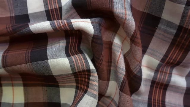 Checkered texture. Plaid material. Close-up. Can be used as a background.