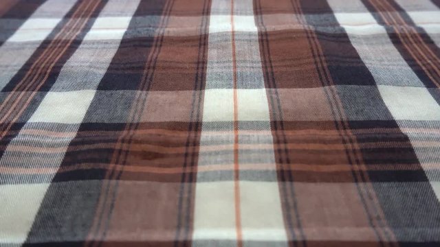Checkered texture. Plaid material. Close-up. Can be used as a background.
