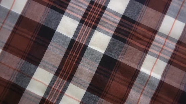 Checkered texture. Plaid material. Close-up. Can be used as a background.