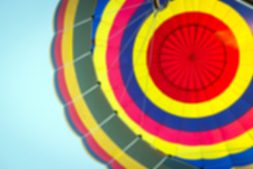 Blurred image for colorful background of hot air balloon is flying on blue sky