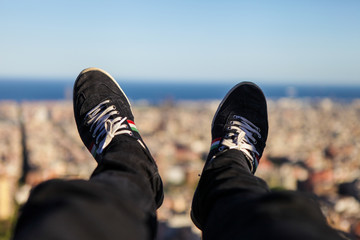 Feet on the foreground and Barcelona on the background