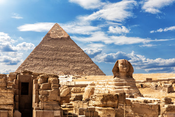 The Sphinx, the Temple and the Pyramid of Chephren under the clouds in Giza