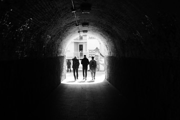 Man silhouettes in a tinnel