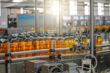 Automatic conveyor belt of production line of juice on beverage plant or factory, modern computerized industrial equipment